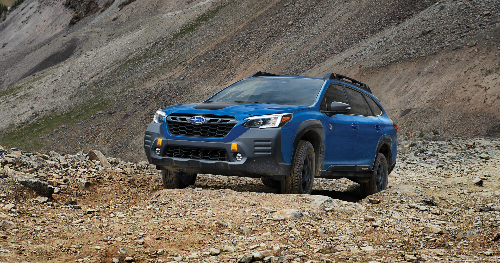 A 2023 Outback Wilderness driving on a trail in the mountains. | Jim Keras Subaru in Memphis TN