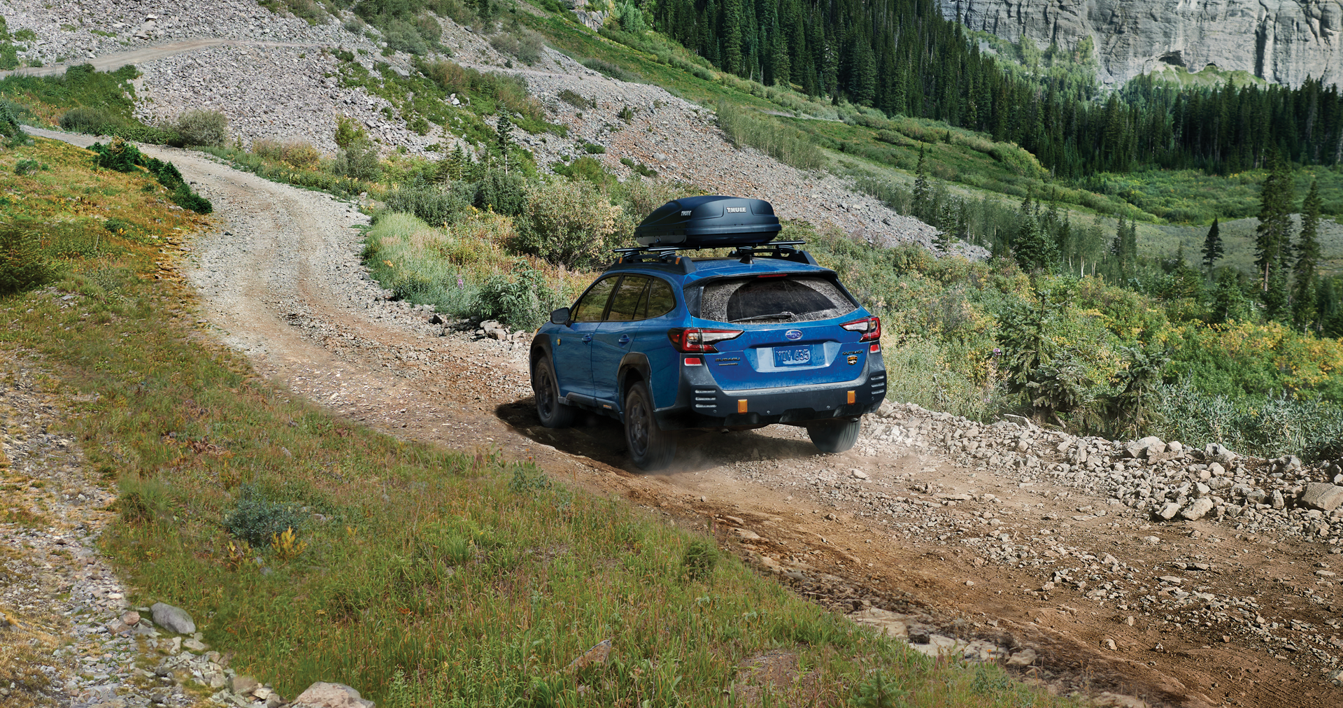 A 2023 Outback Wilderness driving on a trail in the mountains. | Jim Keras Subaru in Memphis TN